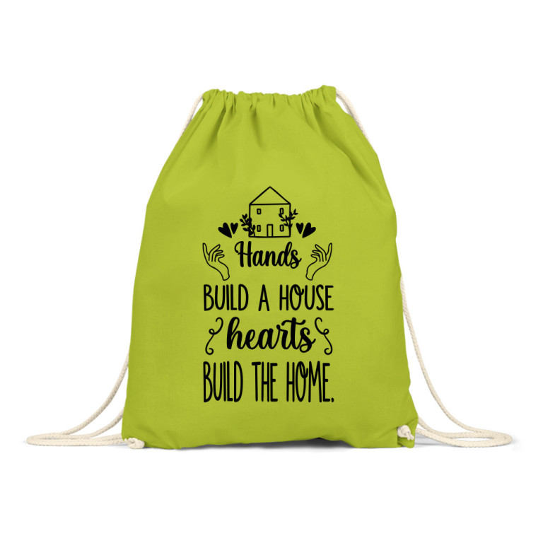 Hands build a house